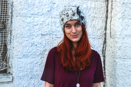 Photo Of Woman In Maroon Top And Knitcap photo