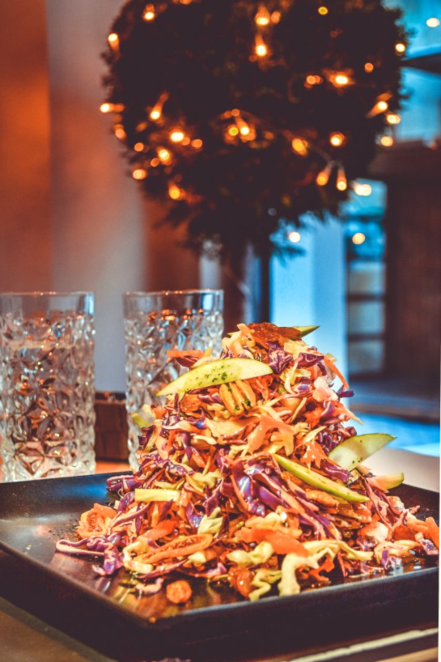 Pile Of Assorted Sliced Vegetables On Square Black Plate