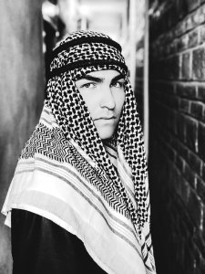 Grayscale Photo Of A Man Wearing Keffiyeh photo