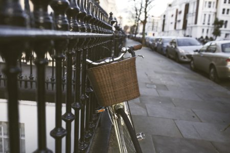 Silver Bicycle On Black Steel Fence photo