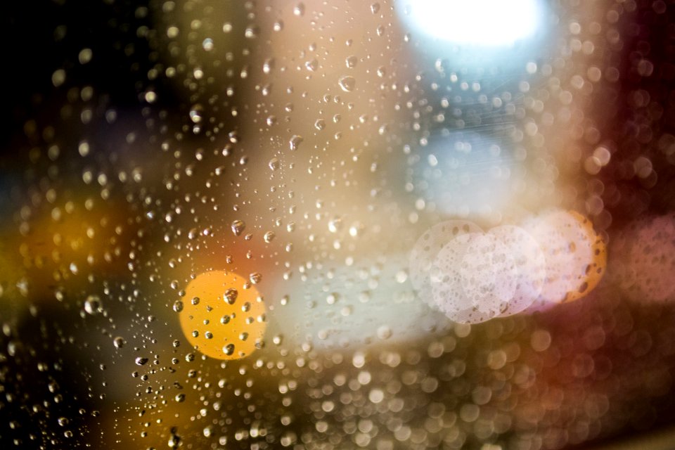 Water Drops On Clear Glass During Nightime