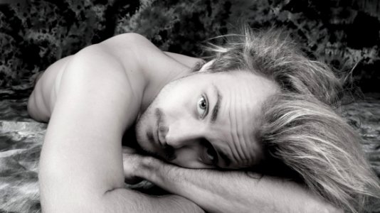 Portrait Of Man Lying Down photo