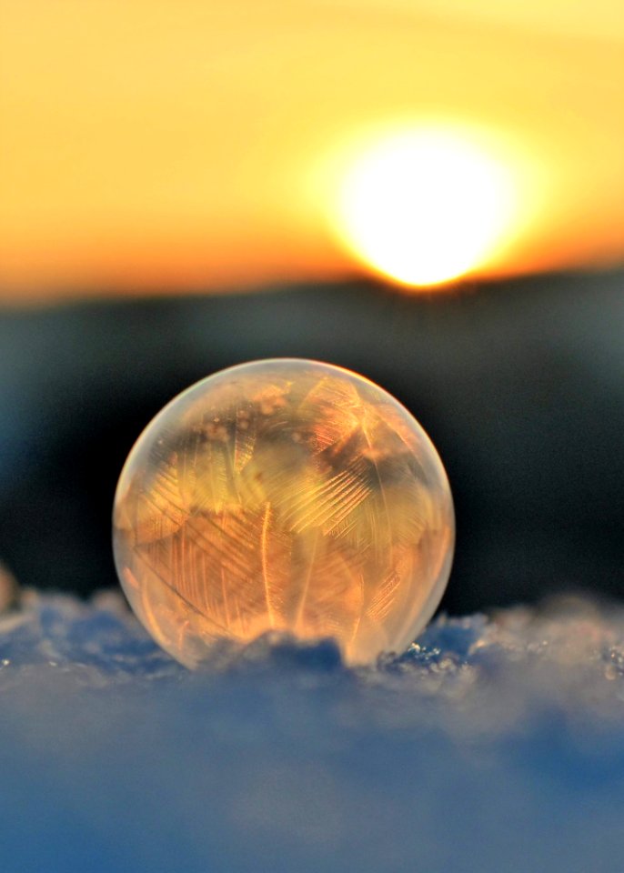 Frozen Soap Bubble Against Sky During Sunset