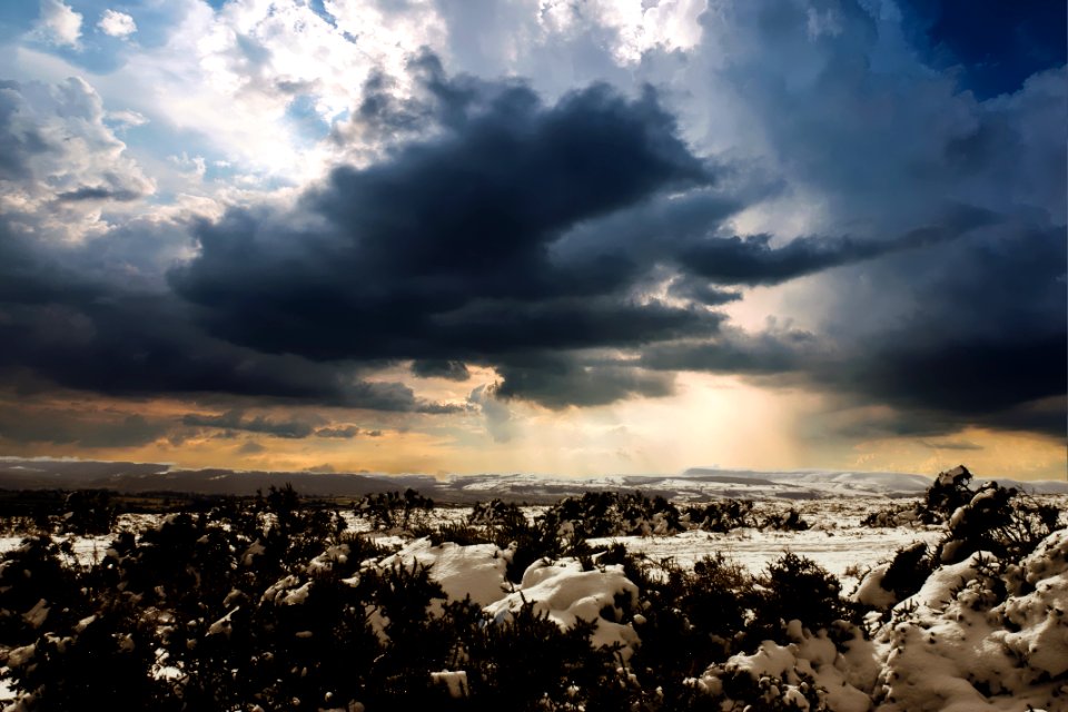 Aerial View Of City Against Cloudy Sky