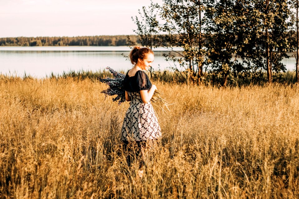 Woman Wears Black And Grey Dress Stands In Field