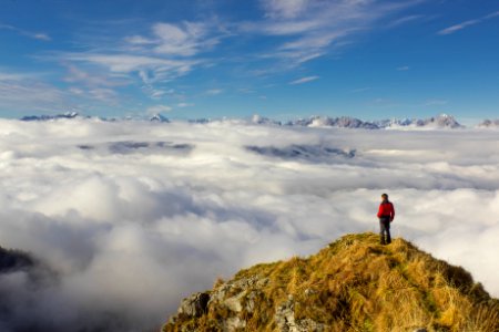 Man Standing On Mountain Against Sky photo