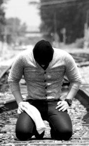 Black-and-white Guy Kneeling photo