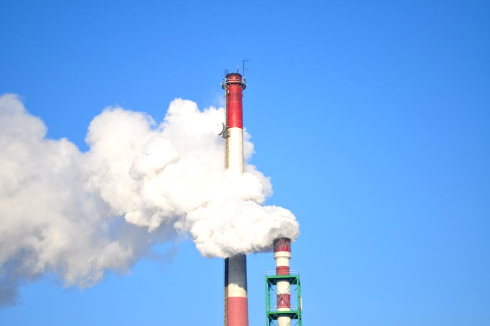 Smoke Stacks Against Blue Sky
