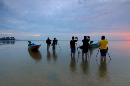 People On Beach Against Sky photo