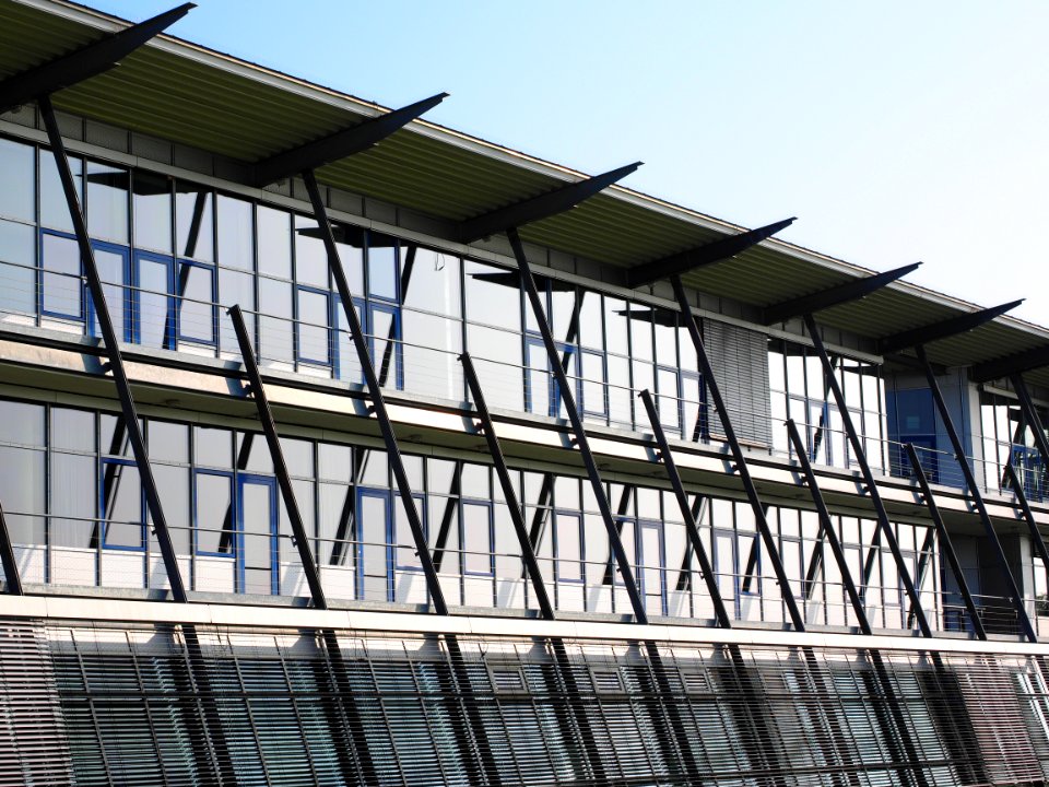 Low Angle View Of Office Building Against Sky photo