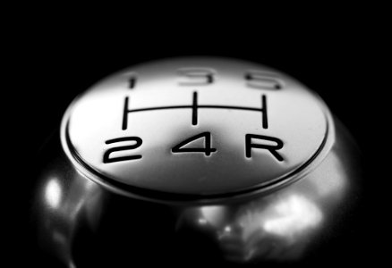 Close-up Of Gear Shift Over Black Background photo