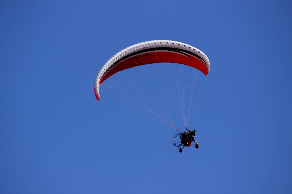 Person Paragliding During Daytime
