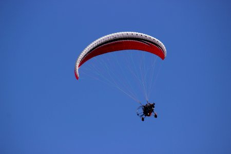 Person Paragliding During Daytime