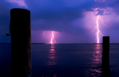 Lightning Over Sea Against Storm Clouds