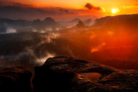 Scenic View Of Mountains During Sunset photo