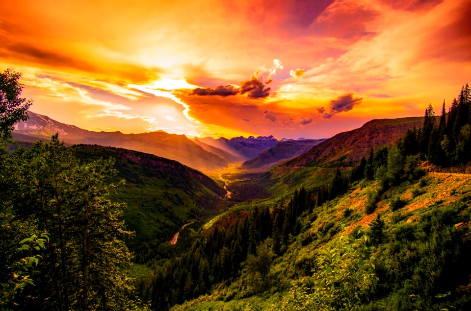 Green Mountain Near River Under Cloudy Sky During Daytime photo