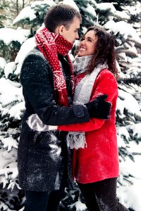 Full Length Of Happy Friends In Snow On Field