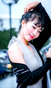 Woman In Gray Halter Dress Standing On Street