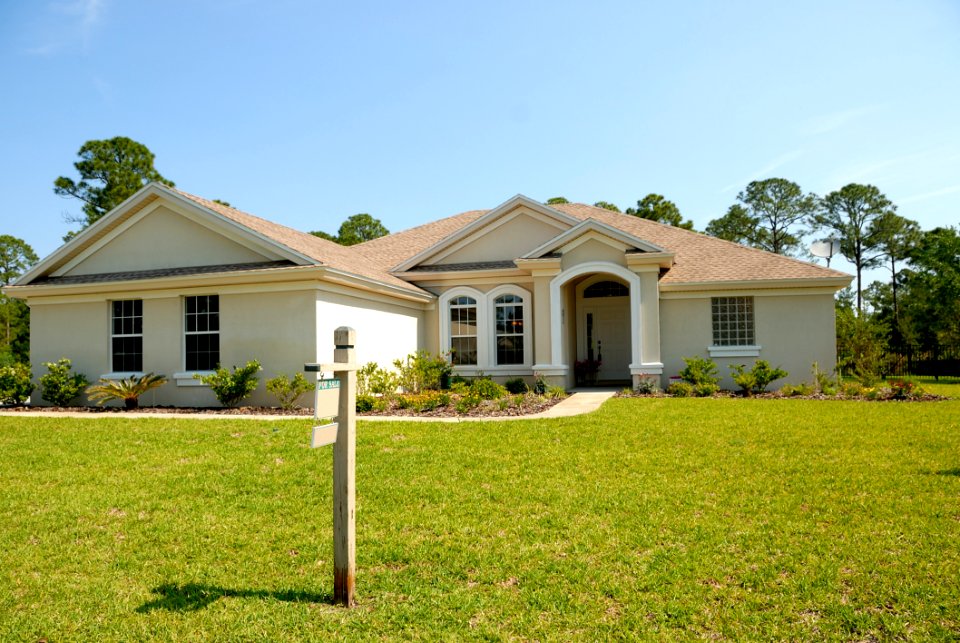 White And Brown Concrete Bungalow Under Clear Blue Sky
