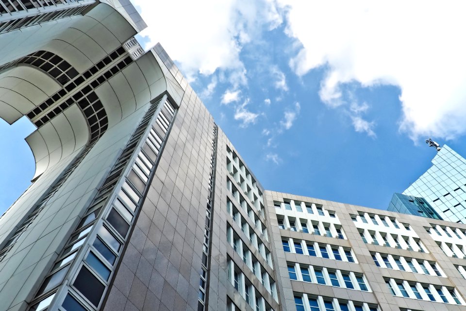 Grey Concrete High Rise Building Under Blue Sky photo