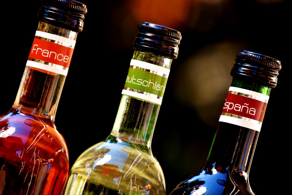 Shallow Focus Photofrapy Of France Leutschien Espana Labeled Glass Bottles