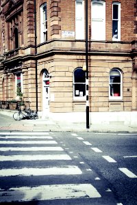 Black Bicycle Parked On The Edge Of A Street During Daytime