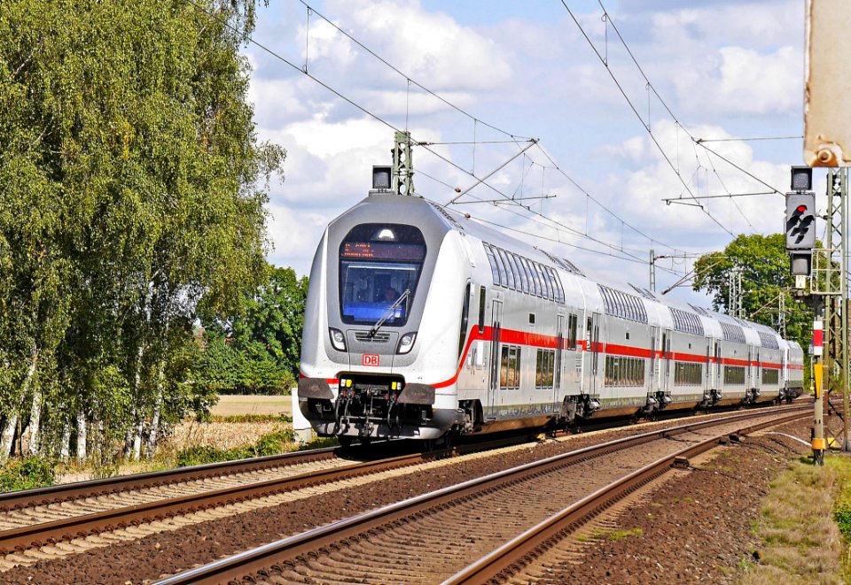 Gray And Red Train During Daytime