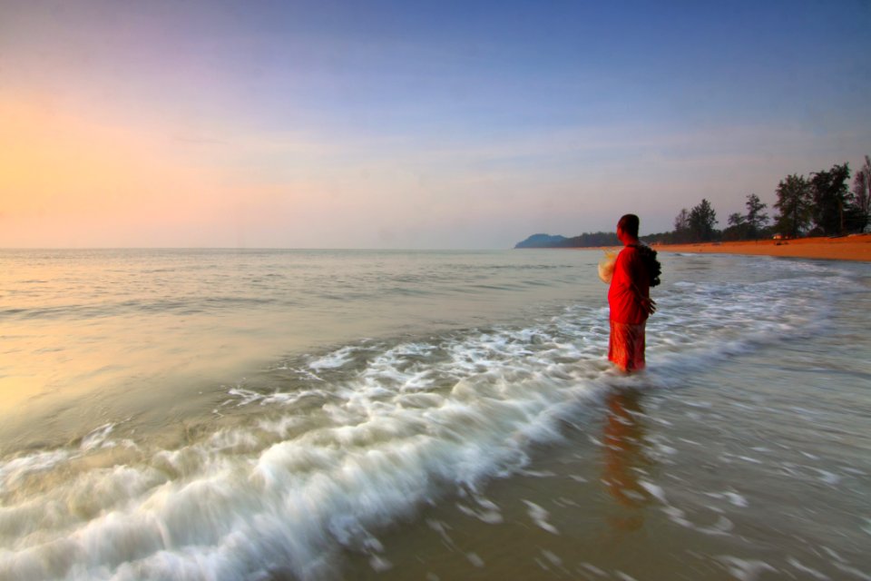 Person On The Seashore During Sun Set