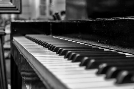Close Up Shot Of Upright Piano Grayscale Photo photo