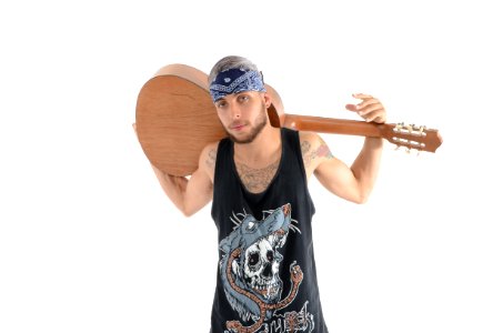 Man In Black And Grey Tank Top Carrying Brown Classical Guitar photo