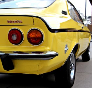 Yellow And Black Muscle Car Parked During Daytime photo