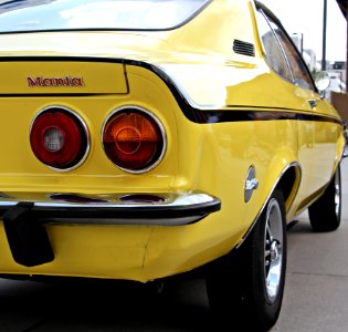Yellow And Black Muscle Car Parked During Daytime