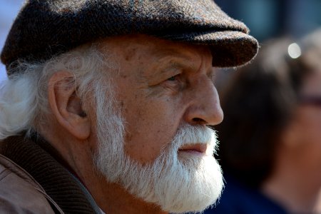 Selective Focus Photography Of Man In Flat Cap During Daytime photo