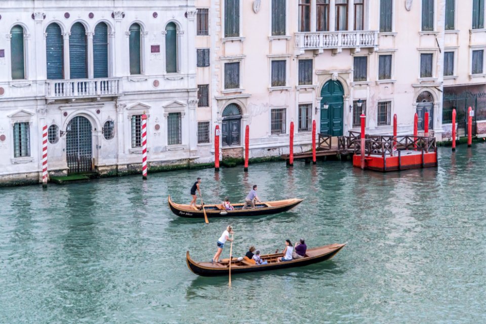 Green Canoe With People Inside
