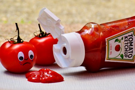 2 Tomatoes Beside Tomato Ketchup Ketchup photo