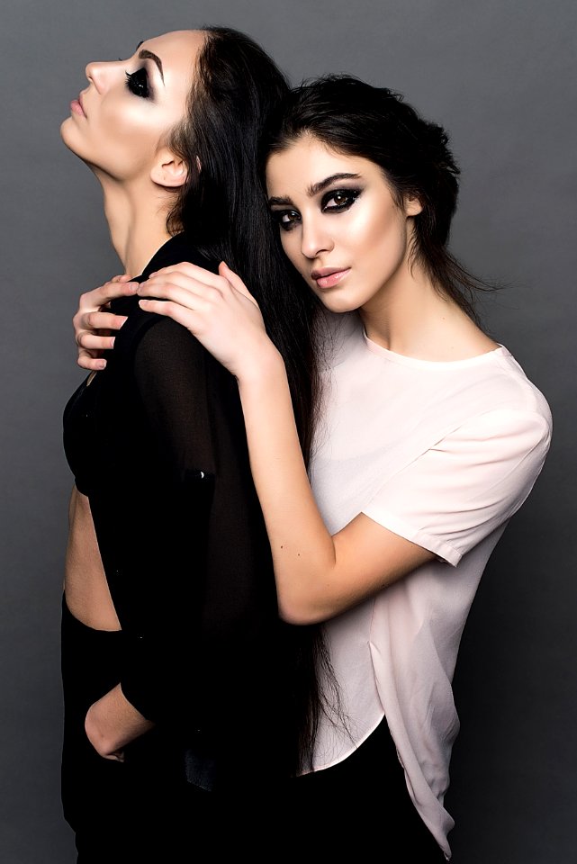 Woman In White Crew Neck T Shirt Embracing Woman In Black Chiffon Sport Shirt