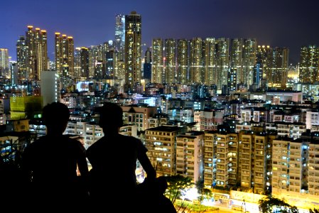 Silhouette Of 2 Person On Top Of The Building During Nighttime photo