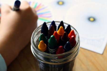 Multicolored Crayons Inside Clear Plastic Round Case photo