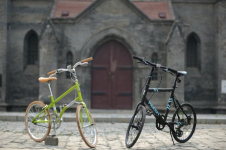 Green Bike Beside Black Bike photo