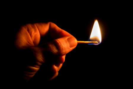 Person Holding Match Stick