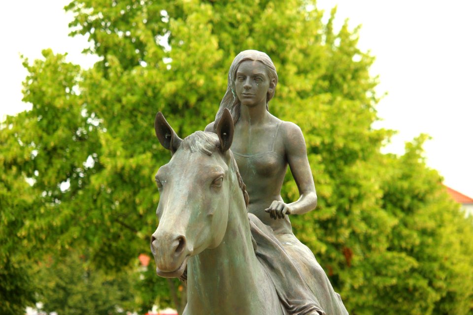 Woman Riding Horse Statue