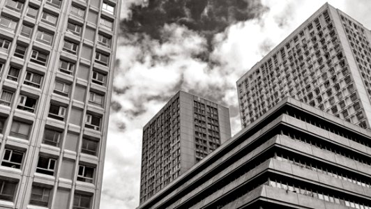 Greyscale Photography Of High Rise Building photo