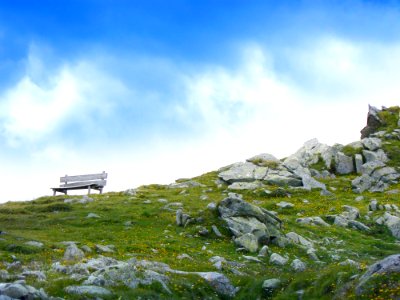 White Wooden Bench In Mountain During Daytime photo