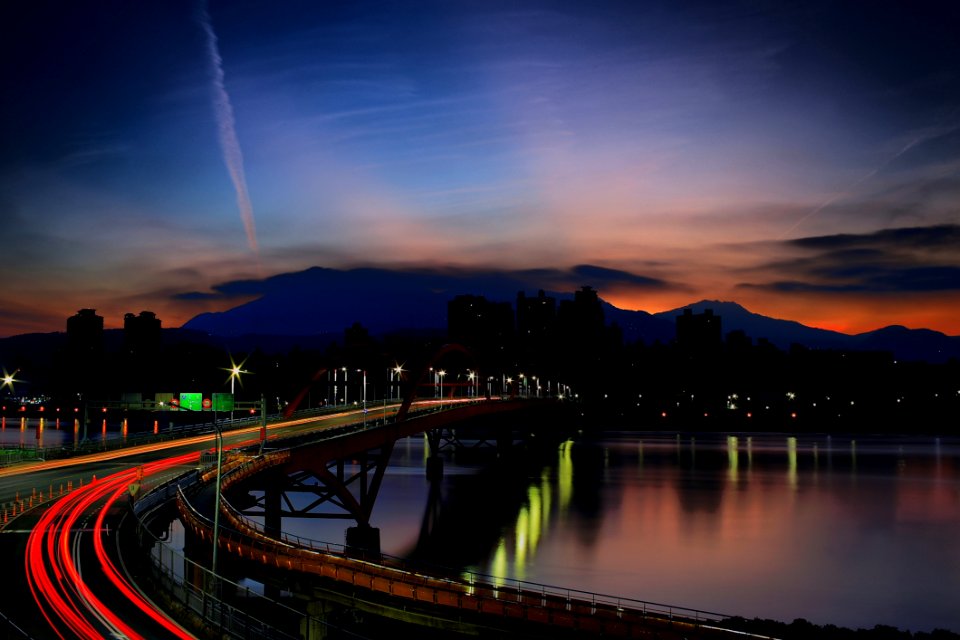 Light Rays On Bridge During Nighttime