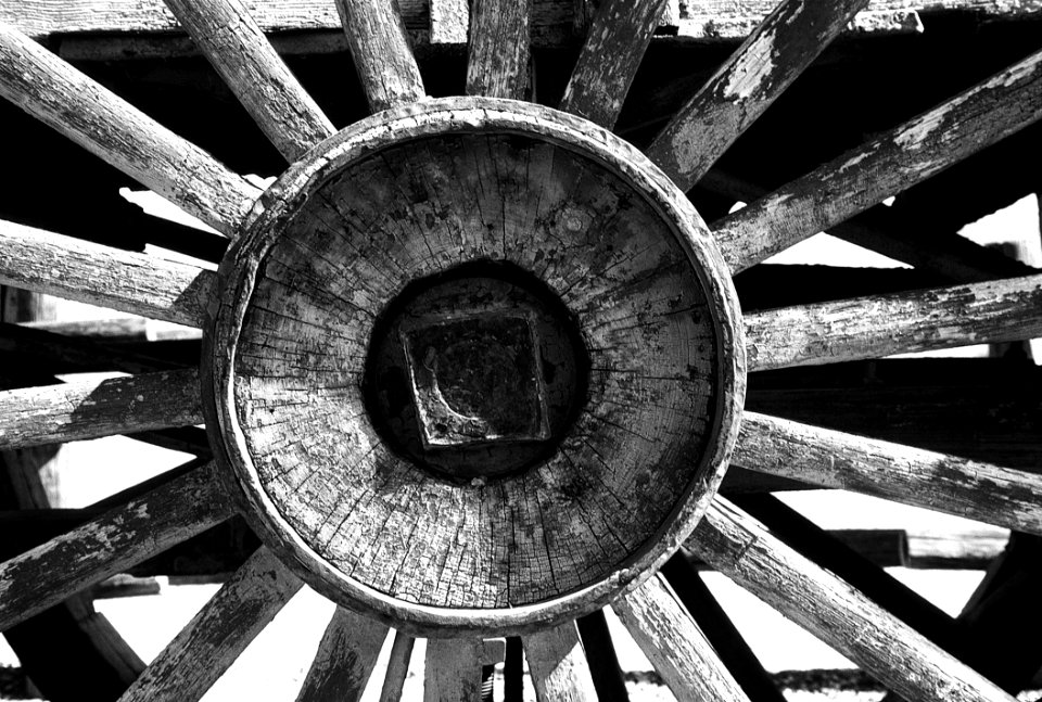 Grayscale Photography Of Carriage Wheel
