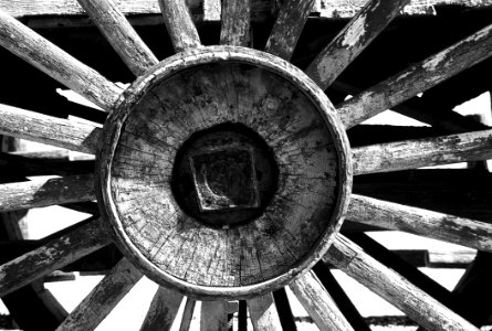 Grayscale Photography Of Carriage Wheel photo