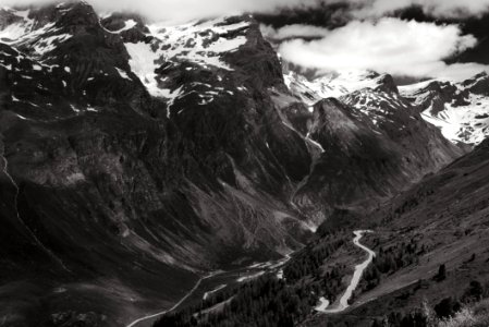 Greyscale Photo Of Mountains Surrounded By Clouds photo
