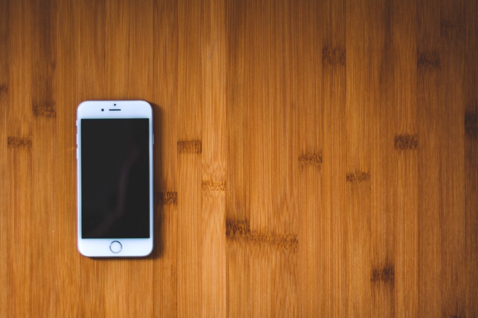 Silver Iphone 6 On Brown Wooden Surface