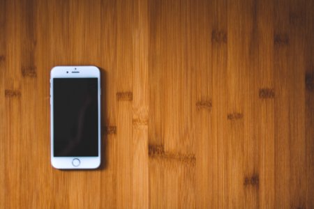 Silver Iphone 6 On Brown Wooden Surface photo