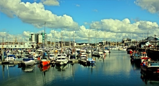 Boats Buildings Clouds photo